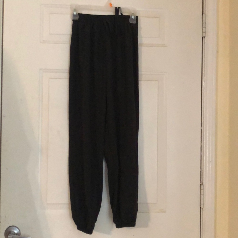 Black parachute type pants with ties.